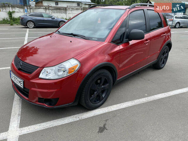 Красный Сузуки СХ4, объемом двигателя 2 л и пробегом 315 тыс. км за 8500 $, фото 1 на Automoto.ua