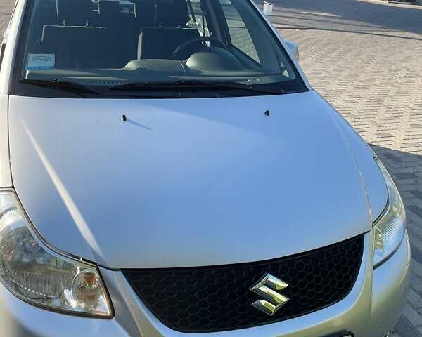Серый Сузуки СХ4, объемом двигателя 1.6 л и пробегом 70 тыс. км за 7500 $, фото 1 на Automoto.ua