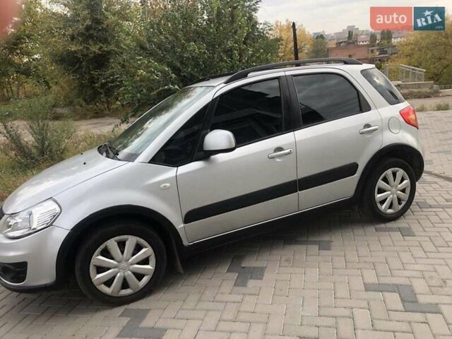 Серый Сузуки СХ4, объемом двигателя 1.59 л и пробегом 210 тыс. км за 7500 $, фото 1 на Automoto.ua