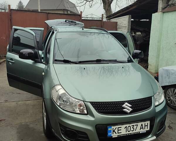 Зеленый Сузуки СХ4, объемом двигателя 1.59 л и пробегом 173 тыс. км за 7500 $, фото 1 на Automoto.ua