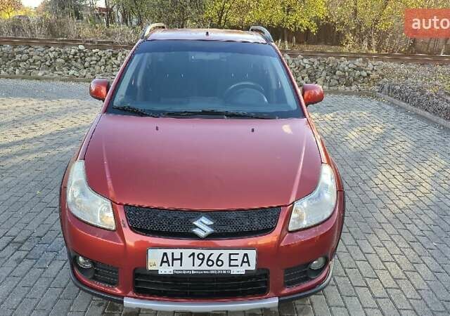 Помаранчевий Сузукі СХ4, об'ємом двигуна 1.6 л та пробігом 68 тис. км за 9000 $, фото 1 на Automoto.ua