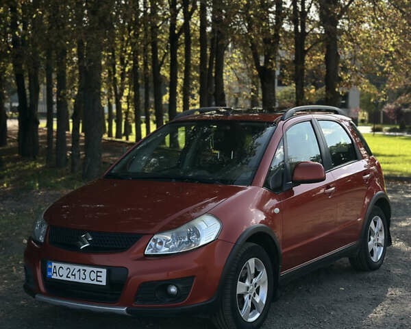 Помаранчевий Сузукі СХ4, об'ємом двигуна 1.59 л та пробігом 204 тис. км за 6799 $, фото 1 на Automoto.ua