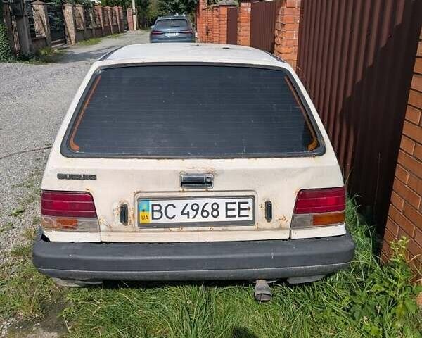 Белый Сузуки Свифт, объемом двигателя 1 л и пробегом 420 тыс. км за 194 $, фото 1 на Automoto.ua
