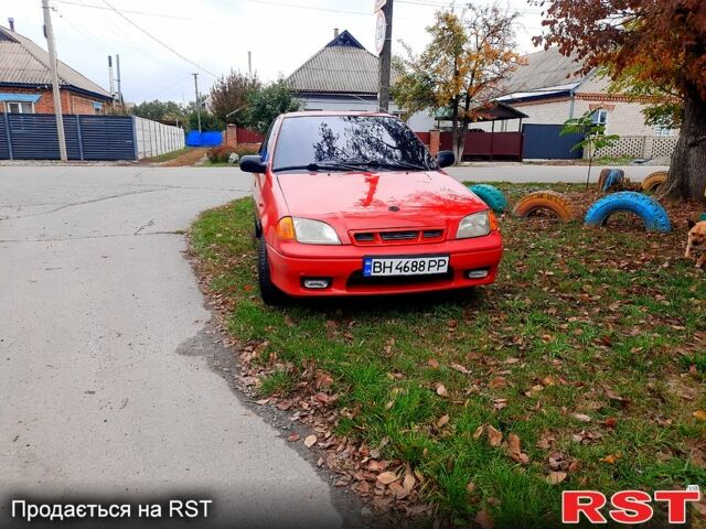 Красный Сузуки Свифт, объемом двигателя 1.3 л и пробегом 280 тыс. км за 1700 $, фото 1 на Automoto.ua