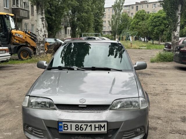 Серый Сузуки Свифт, объемом двигателя 1.3 л и пробегом 400 тыс. км за 1147 $, фото 1 на Automoto.ua
