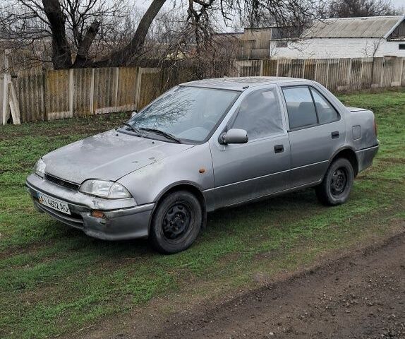 Сірий Сузукі Свифт, об'ємом двигуна 1.3 л та пробігом 220 тис. км за 339 $, фото 1 на Automoto.ua