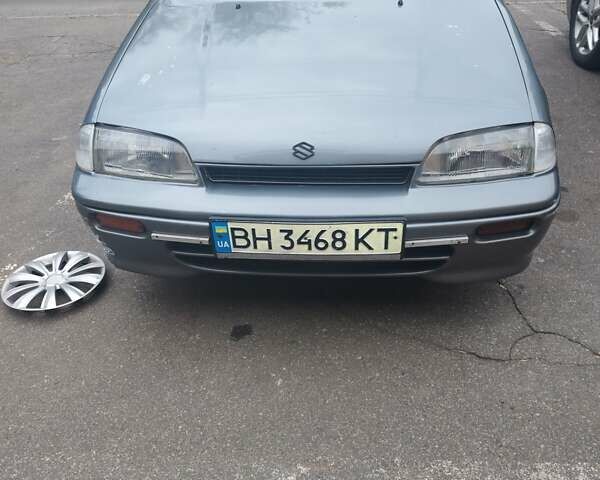 Серый Сузуки Свифт, объемом двигателя 1.3 л и пробегом 350 тыс. км за 1999 $, фото 1 на Automoto.ua