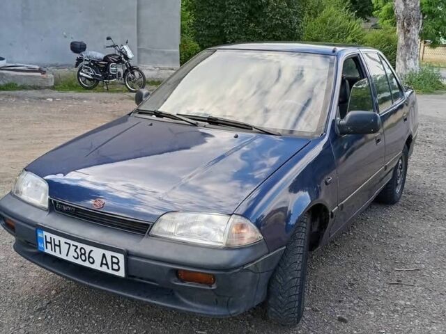 Синий Сузуки Свифт, объемом двигателя 1.3 л и пробегом 299 тыс. км за 450 $, фото 1 на Automoto.ua