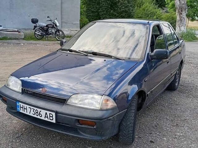 Синий Сузуки Свифт, объемом двигателя 1.3 л и пробегом 270 тыс. км за 350 $, фото 1 на Automoto.ua