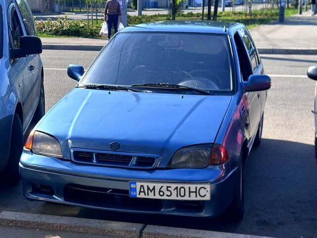 Синий Сузуки Свифт, объемом двигателя 1 л и пробегом 200 тыс. км за 1000 $, фото 1 на Automoto.ua