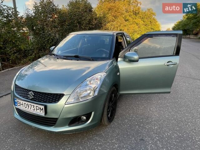 Зелений Сузукі Свифт, об'ємом двигуна 1.24 л та пробігом 136 тис. км за 7700 $, фото 1 на Automoto.ua