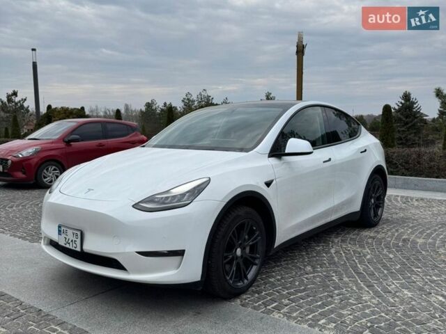 Белый Тесла Model Y, объемом двигателя 0 л и пробегом 77 тыс. км за 23000 $, фото 1 на Automoto.ua