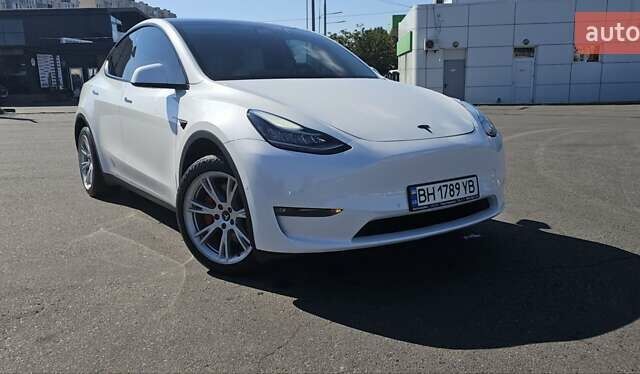 Белый Тесла Model Y, объемом двигателя 0 л и пробегом 119 тыс. км за 24000 $, фото 1 на Automoto.ua
