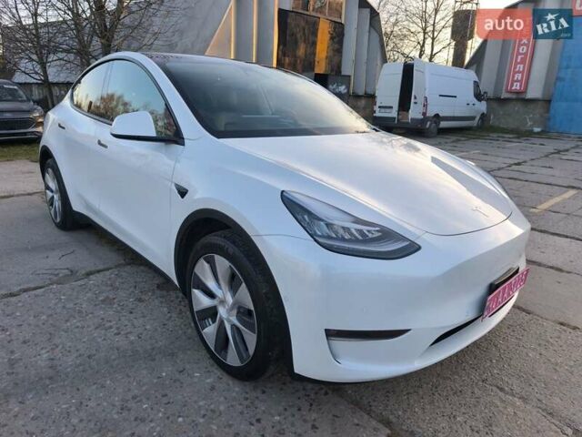 Білий Тесла Model Y, об'ємом двигуна 0 л та пробігом 86 тис. км за 25300 $, фото 1 на Automoto.ua