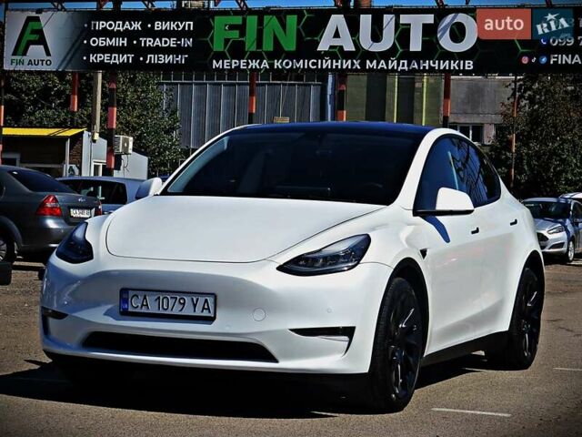 Білий Тесла Model Y, об'ємом двигуна 0 л та пробігом 67 тис. км за 25500 $, фото 1 на Automoto.ua
