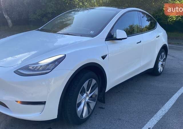 Білий Тесла Model Y, об'ємом двигуна 0 л та пробігом 100 тис. км за 25400 $, фото 1 на Automoto.ua