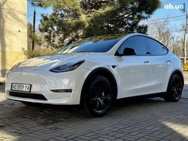 Белый Тесла Model Y, объемом двигателя 0 л и пробегом 58 тыс. км за 27900 $, фото 1 на Automoto.ua