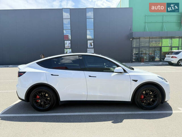 Білий Тесла Model Y, об'ємом двигуна 0 л та пробігом 90 тис. км за 31000 $, фото 1 на Automoto.ua