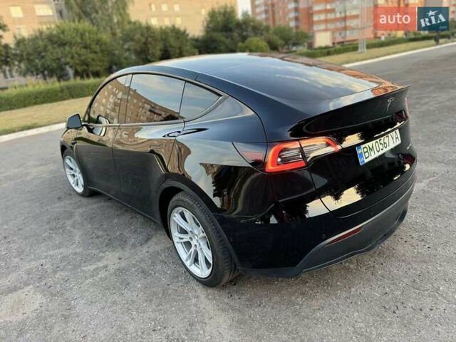 Черный Тесла Model Y, объемом двигателя 0 л и пробегом 101 тыс. км за 24999 $, фото 1 на Automoto.ua