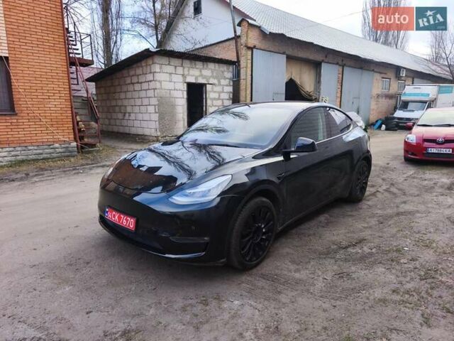 Черный Тесла Model Y, объемом двигателя 0 л и пробегом 65 тыс. км за 24999 $, фото 1 на Automoto.ua