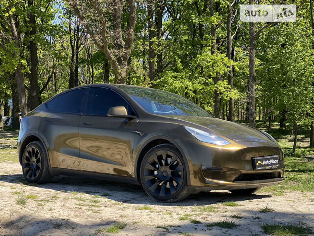 Коричневый Тесла Model Y, объемом двигателя 0 л и пробегом 66 тыс. км за 29999 $, фото 1 на Automoto.ua