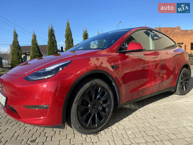 Червоний Тесла Model Y, об'ємом двигуна 0 л та пробігом 29 тис. км за 25750 $, фото 1 на Automoto.ua