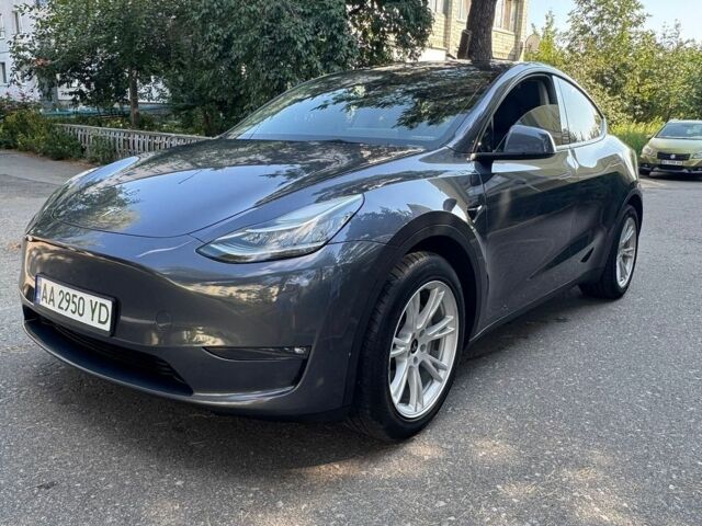 Серый Тесла Model Y, объемом двигателя 0 л и пробегом 103 тыс. км за 24900 $, фото 1 на Automoto.ua