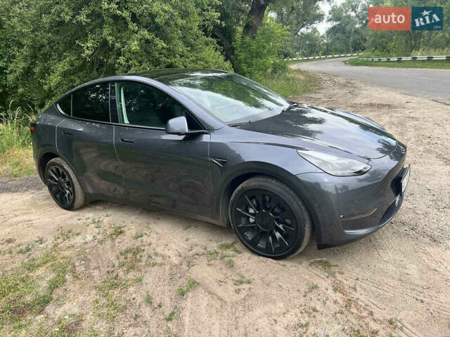 Серый Тесла Model Y, объемом двигателя 0 л и пробегом 61 тыс. км за 29000 $, фото 1 на Automoto.ua