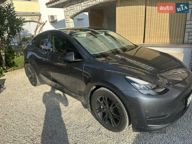 Серый Тесла Model Y, объемом двигателя 0 л и пробегом 49 тыс. км за 30700 $, фото 1 на Automoto.ua