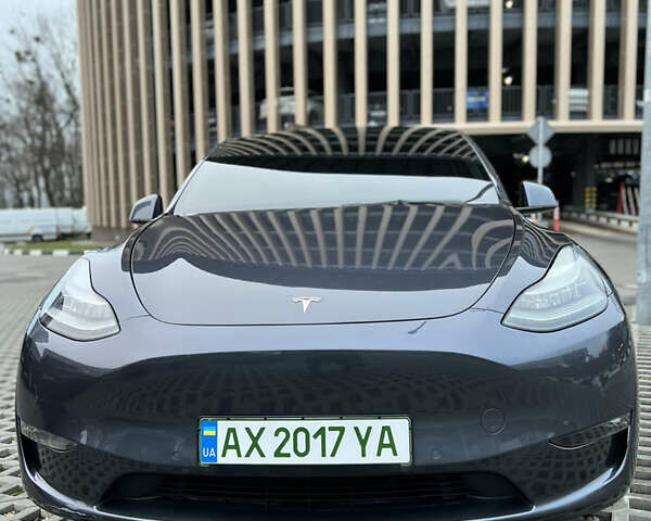 Серый Тесла Model Y, объемом двигателя 0 л и пробегом 22 тыс. км за 26900 $, фото 1 на Automoto.ua