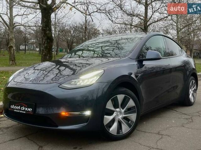 Серый Тесла Model Y, объемом двигателя 0 л и пробегом 92 тыс. км за 24499 $, фото 1 на Automoto.ua