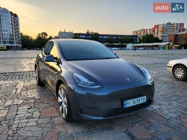 Серый Тесла Model Y, объемом двигателя 0 л и пробегом 49 тыс. км за 26950 $, фото 1 на Automoto.ua