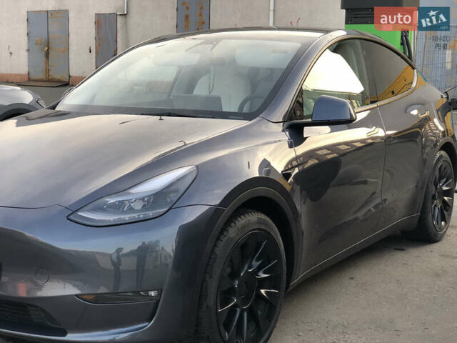 Серый Тесла Model Y, объемом двигателя 0 л и пробегом 23 тыс. км за 28600 $, фото 1 на Automoto.ua