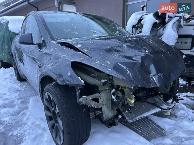 Серый Тесла Model Y, объемом двигателя 0 л и пробегом 26 тыс. км за 18900 $, фото 1 на Automoto.ua