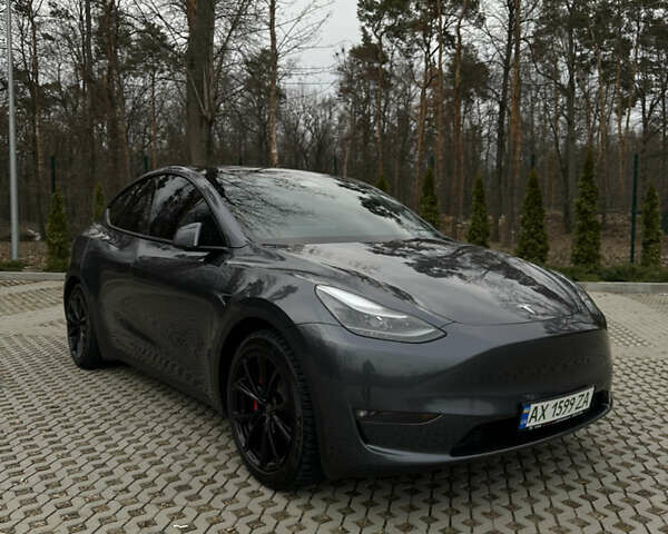 Серый Тесла Model Y, объемом двигателя 0 л и пробегом 22 тыс. км за 32000 $, фото 1 на Automoto.ua