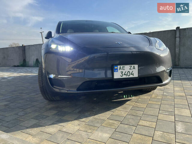 Серый Тесла Model Y, объемом двигателя 0 л и пробегом 25 тыс. км за 29000 $, фото 1 на Automoto.ua