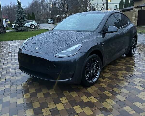 Серый Тесла Model Y, объемом двигателя 0 л и пробегом 14 тыс. км за 28200 $, фото 1 на Automoto.ua