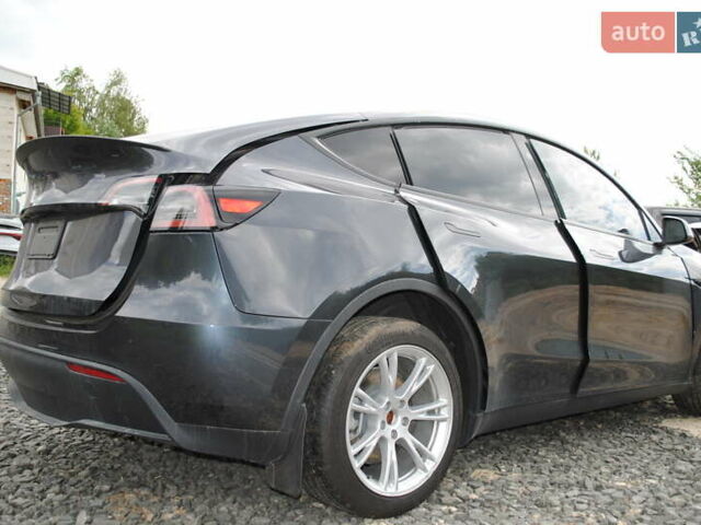 Серый Тесла Model Y, объемом двигателя 0 л и пробегом 21 тыс. км за 18900 $, фото 1 на Automoto.ua