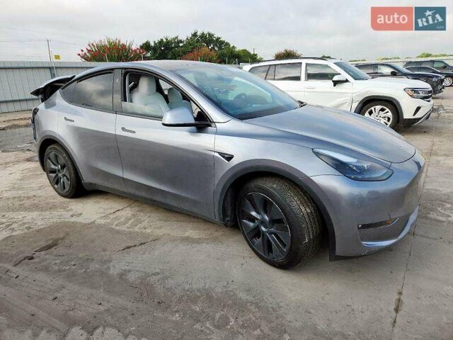 Серый Тесла Model Y, объемом двигателя 0 л и пробегом 26 тыс. км за 21800 $, фото 1 на Automoto.ua