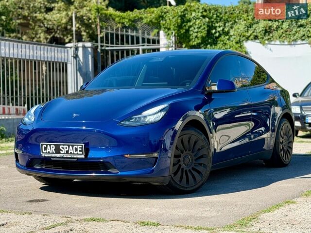 Синий Тесла Model Y, объемом двигателя 0 л и пробегом 70 тыс. км за 22999 $, фото 1 на Automoto.ua
