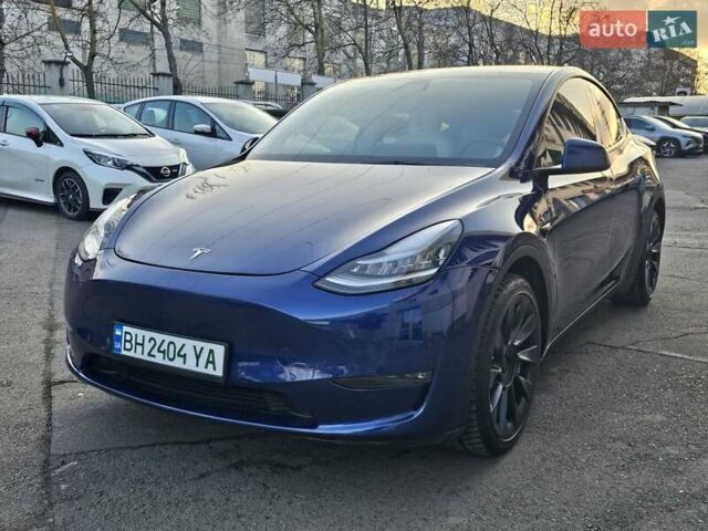 Синий Тесла Model Y, объемом двигателя 0 л и пробегом 65 тыс. км за 27000 $, фото 1 на Automoto.ua