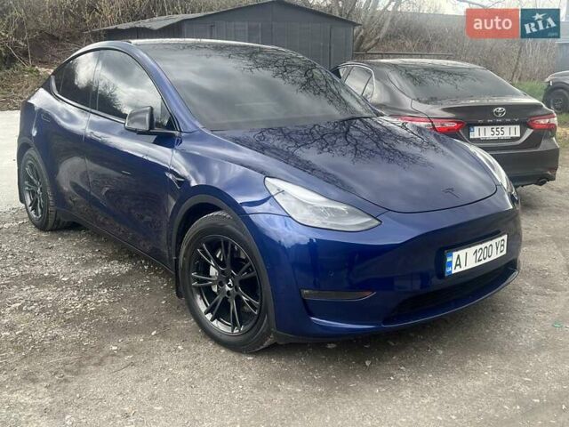Синий Тесла Model Y, объемом двигателя 0 л и пробегом 101 тыс. км за 23999 $, фото 1 на Automoto.ua