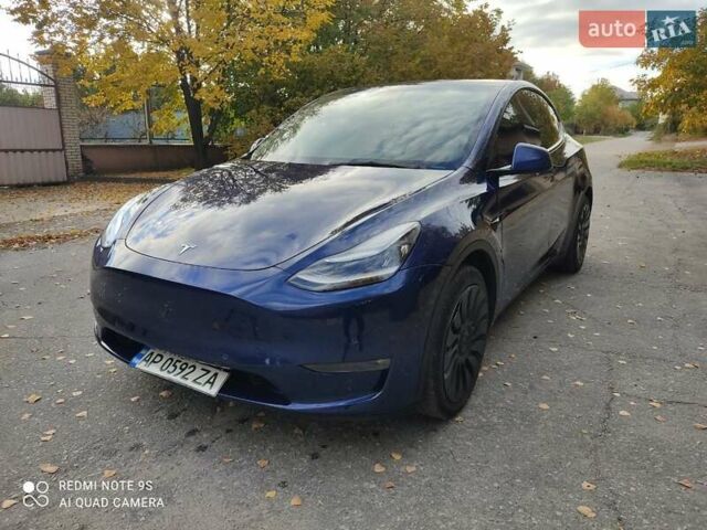 Синий Тесла Model Y, объемом двигателя 0 л и пробегом 58 тыс. км за 24000 $, фото 1 на Automoto.ua