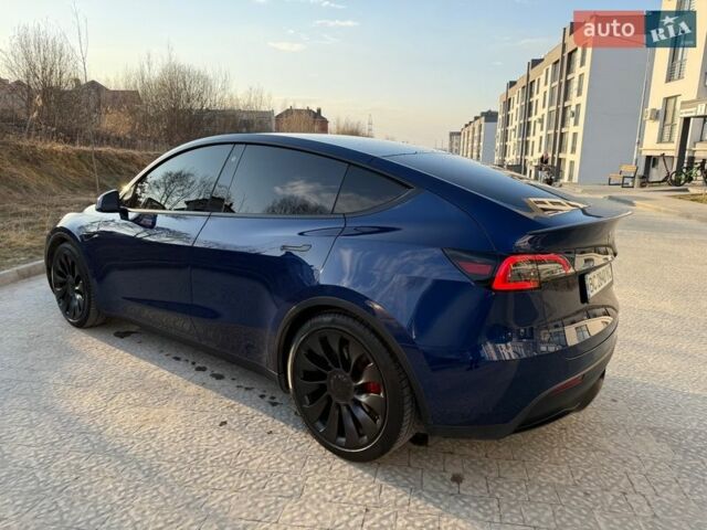 Синий Тесла Model Y, объемом двигателя 0 л и пробегом 99 тыс. км за 22900 $, фото 1 на Automoto.ua
