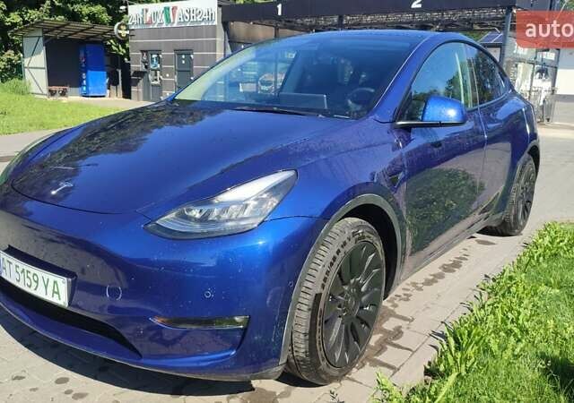 Синий Тесла Model Y, объемом двигателя 0 л и пробегом 54 тыс. км за 29900 $, фото 1 на Automoto.ua