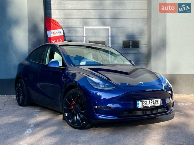 Синий Тесла Model Y, объемом двигателя 0 л и пробегом 92 тыс. км за 31999 $, фото 1 на Automoto.ua