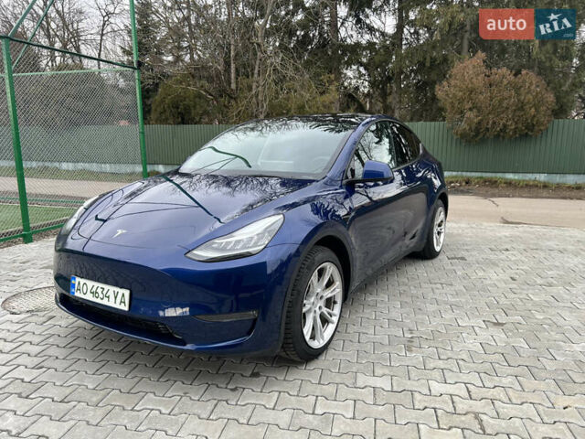 Синий Тесла Model Y, объемом двигателя 0 л и пробегом 86 тыс. км за 24900 $, фото 1 на Automoto.ua