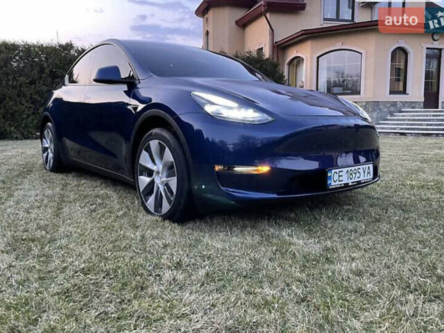 Синий Тесла Model Y, объемом двигателя 0 л и пробегом 51 тыс. км за 28500 $, фото 1 на Automoto.ua