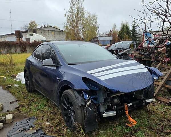 Синий Тесла Model Y, объемом двигателя 0 л и пробегом 106 тыс. км за 20400 $, фото 1 на Automoto.ua
