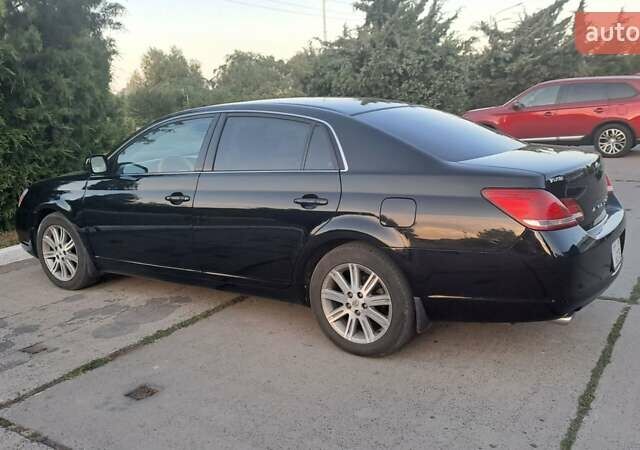 Черный Тойота Авалон, объемом двигателя 3.5 л и пробегом 310 тыс. км за 7599 $, фото 1 на Automoto.ua